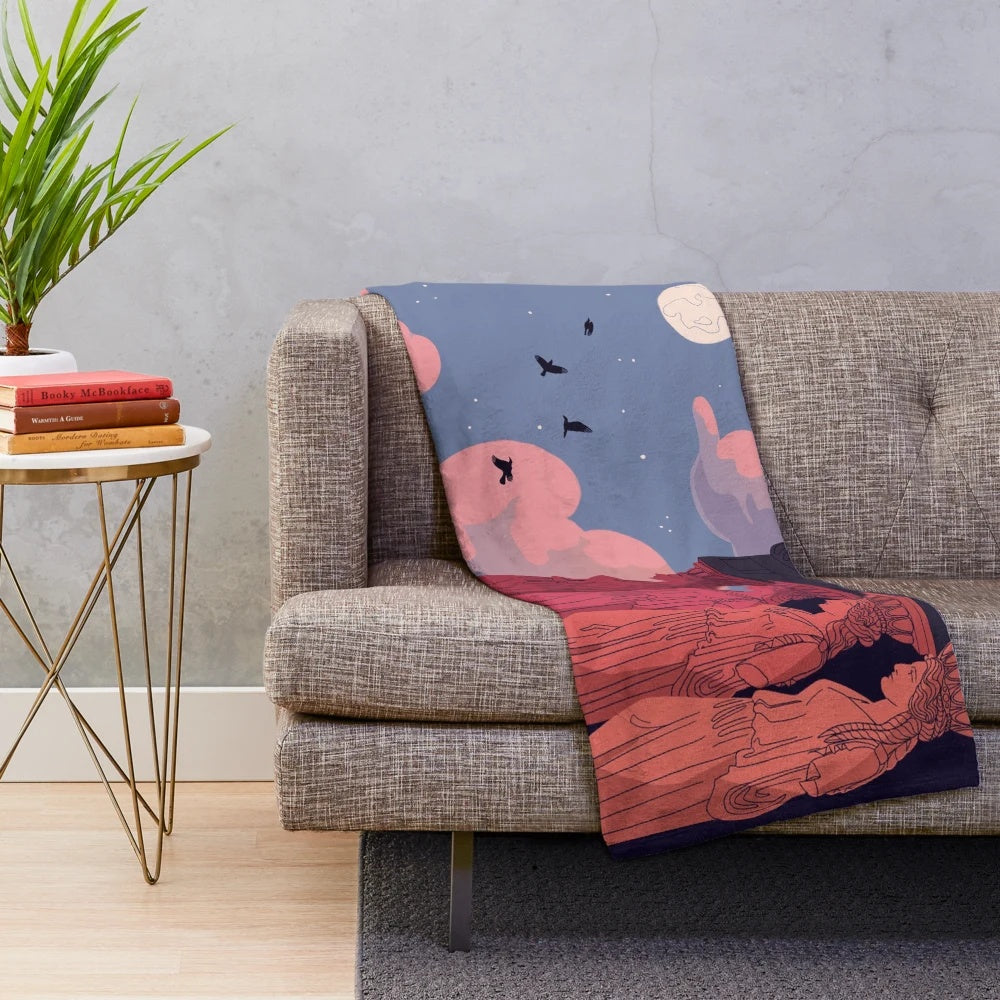 Caryatid figures at dusk on a soft, plush blanket