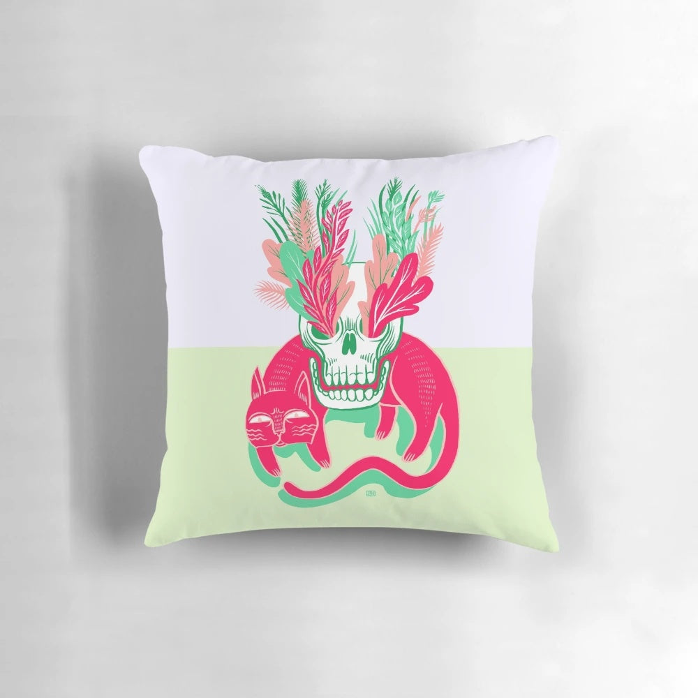 A decorative pillow featuring a detailed cat skull design surrounded by lush floral elements, perfect for adding a touch of natural elegance to your garden.