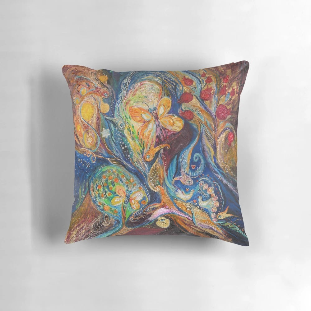 Vibrant Chagall-inspired pillow with abstract, spiritual symbols and Hebrew lettering.