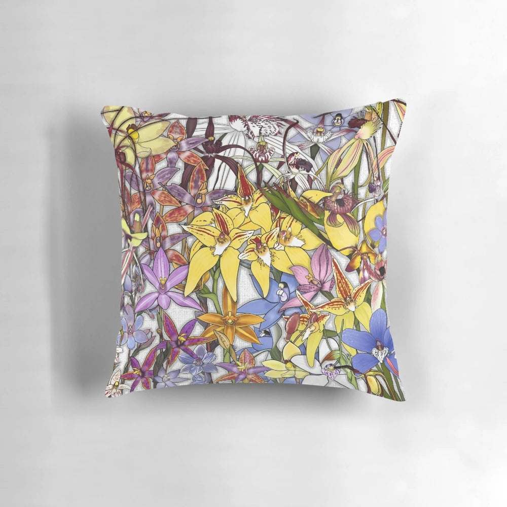 Decorative throw pillow featuring a collage of vibrant Western Australian native orchids, including the Queen of Sheba, Donkey, and Blue China varieties.