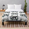 Colorful cougar silhouette painting on a plush blue blanket