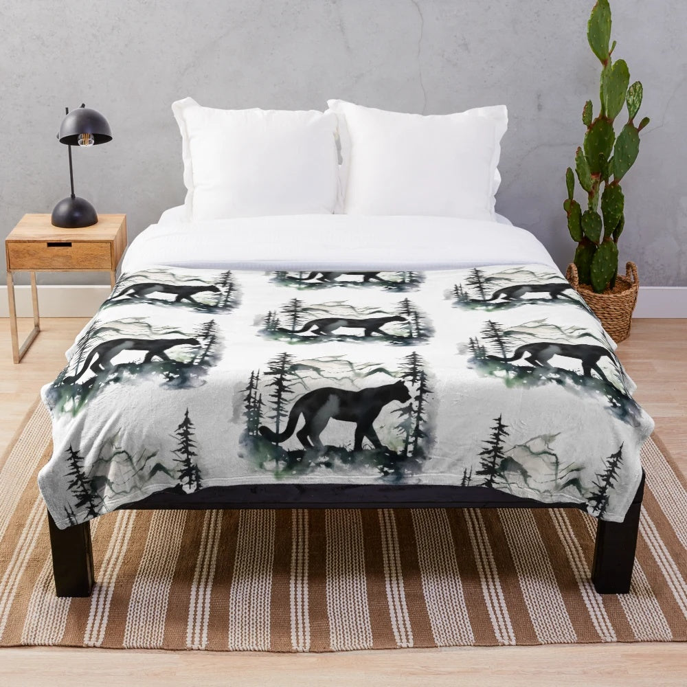 Colorful cougar silhouette painting on a plush blue blanket