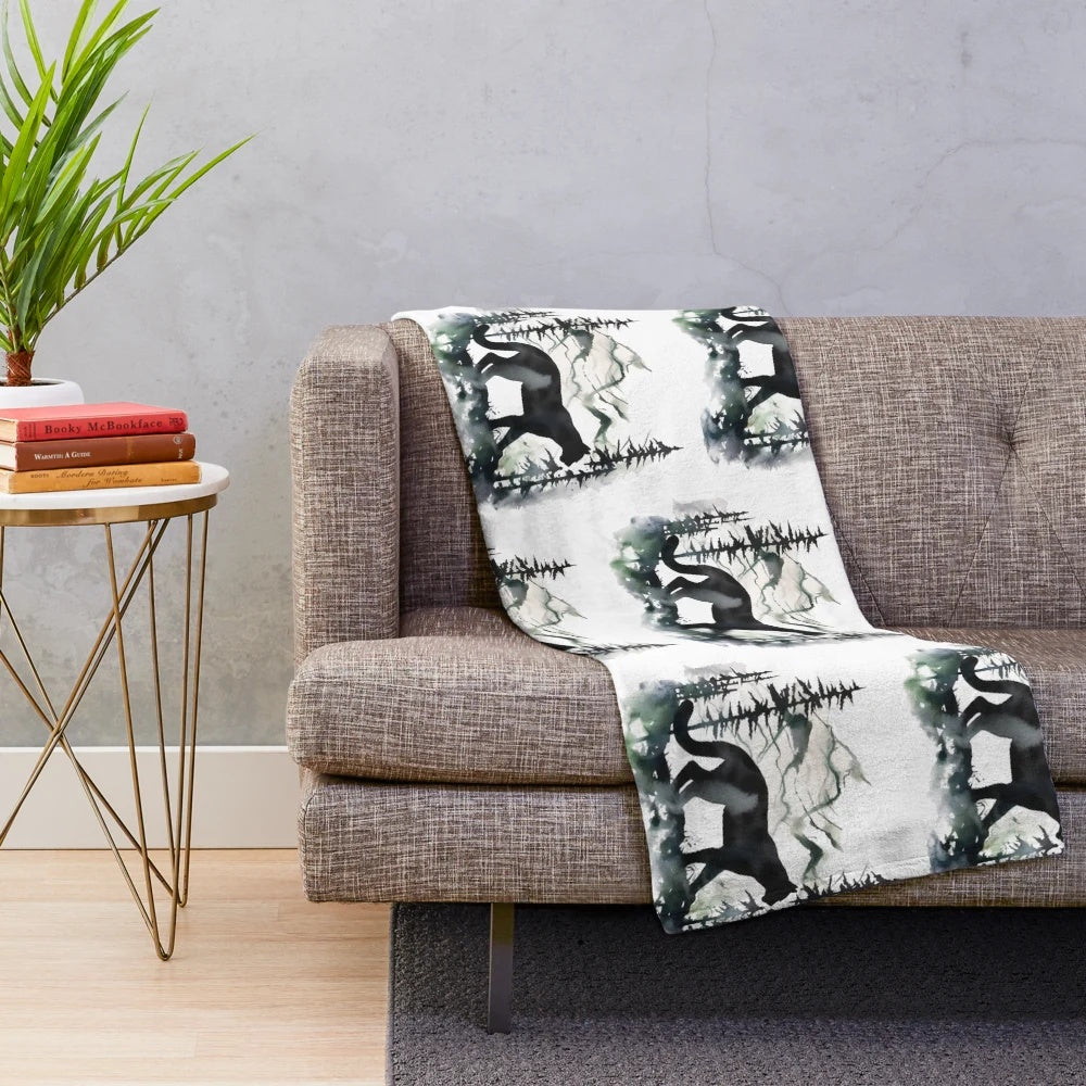 Colorful cougar silhouette painting on a plush blue blanket