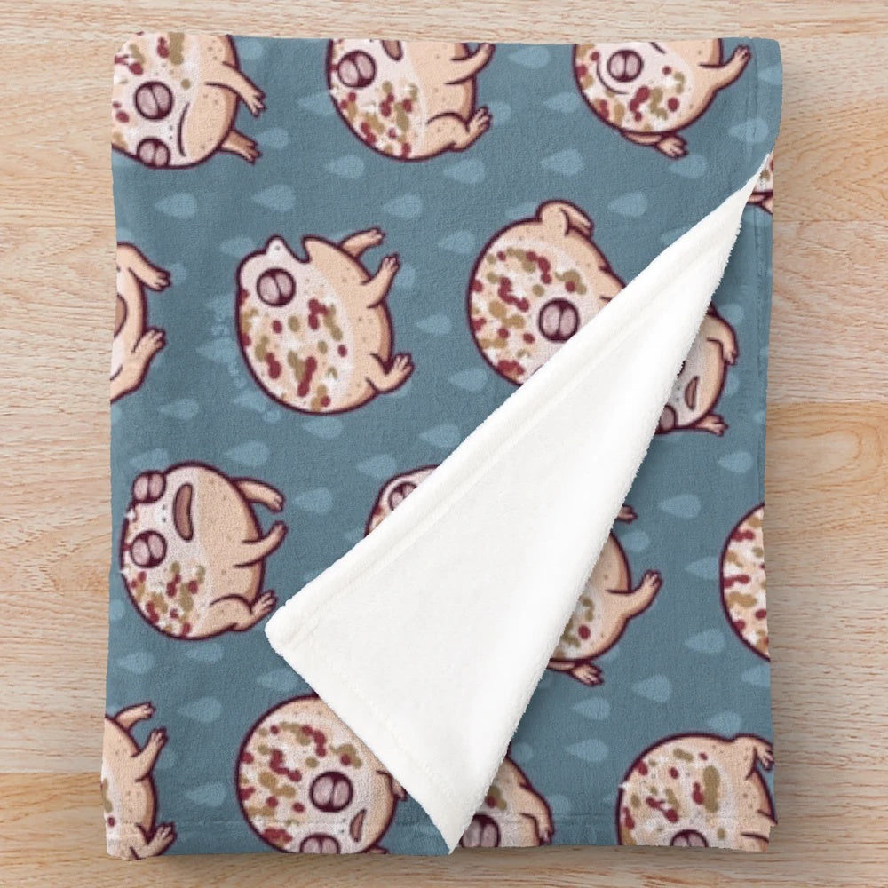 A cozy desert rain frog plush blanket featuring a delightful repeating pattern design.
