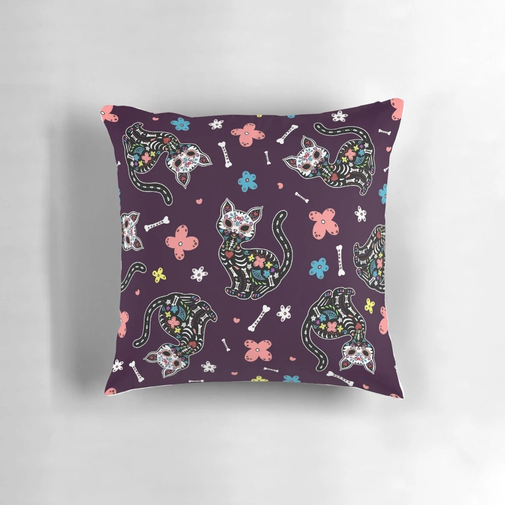 Vibrant dia de los gatos pillow featuring sugar skull and floral design