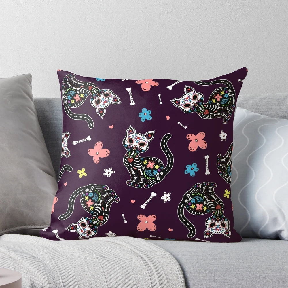 Vibrant dia de los gatos pillow featuring sugar skull and floral design