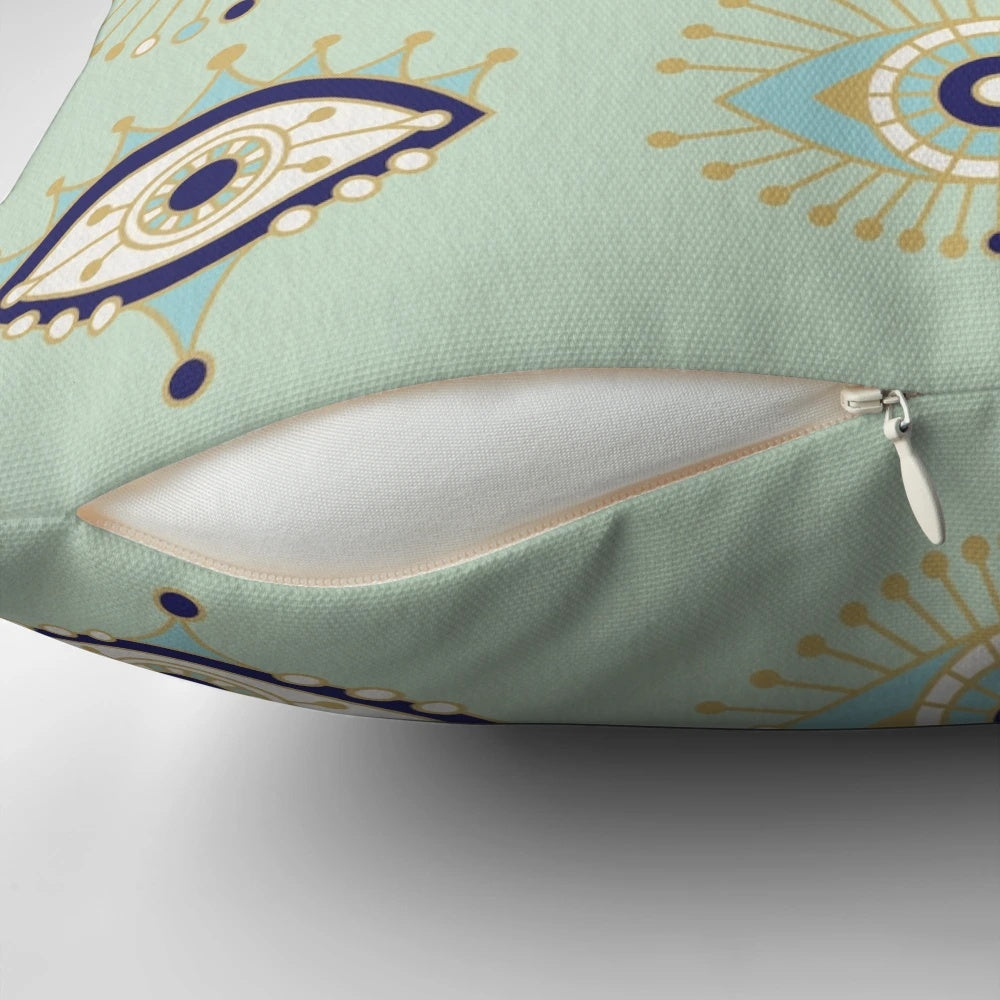 Decorative throw pillow with a vibrant evil eye design in shades of blue, gold, and mint.