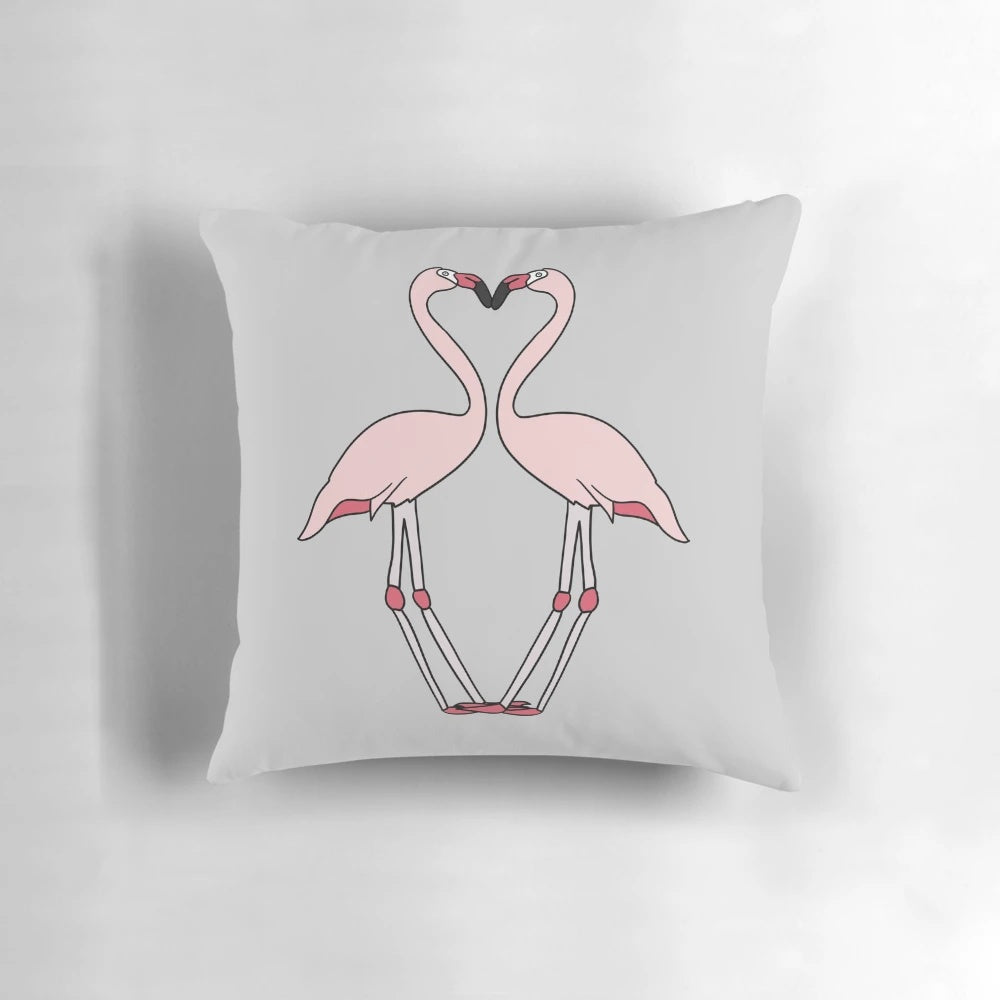 Vibrant flamingo design on a grey pillow for a stylish, nature-inspired home accent.
