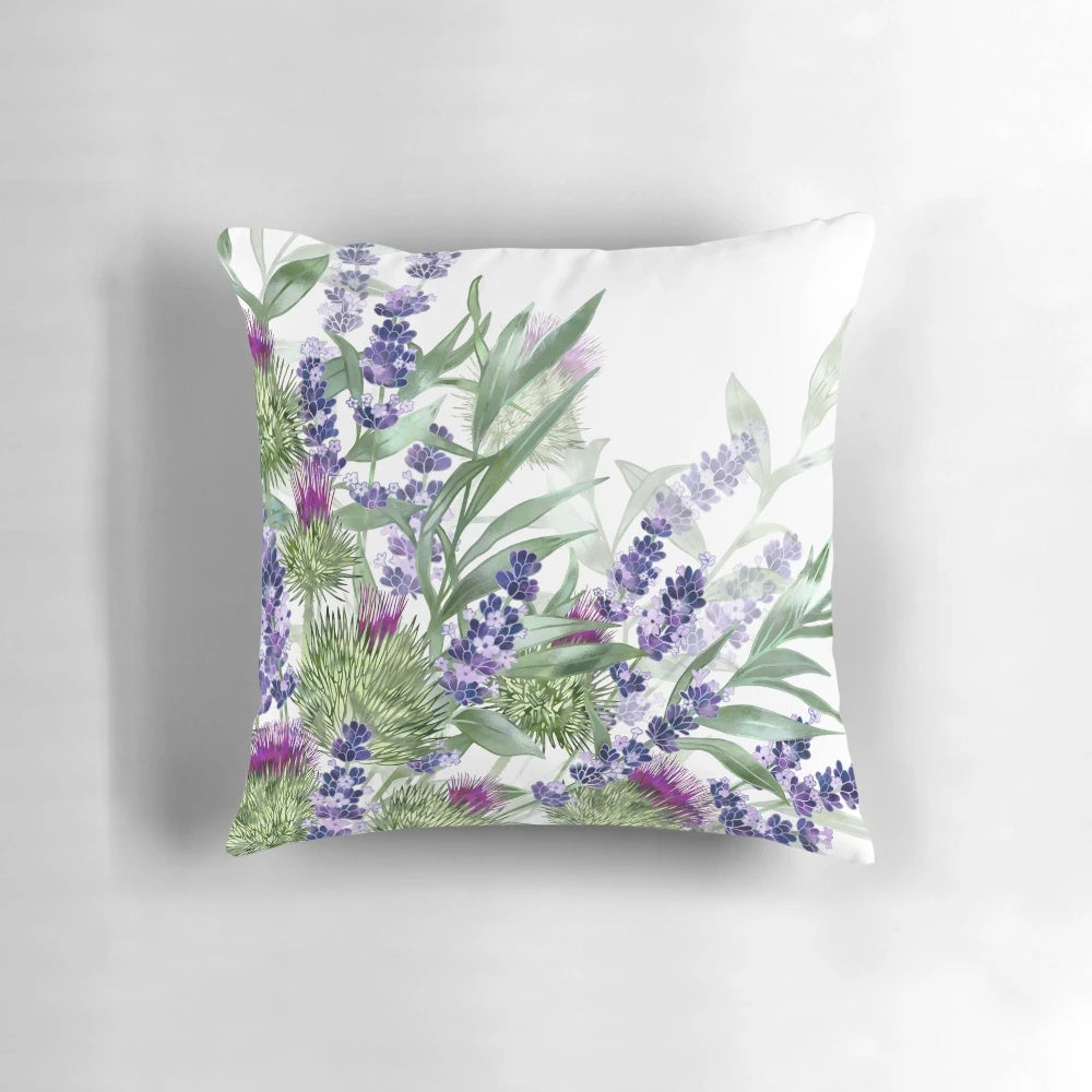 A vibrant and artistic pillow featuring thistles and lavender flowers, created by Scottish designer Fiona Calder.