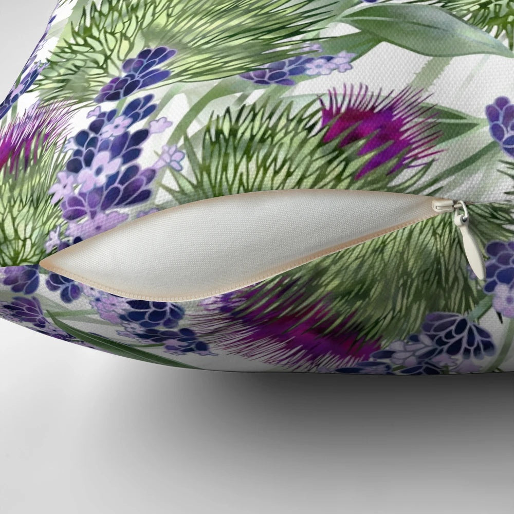 A vibrant and artistic pillow featuring thistles and lavender flowers, created by Scottish designer Fiona Calder.