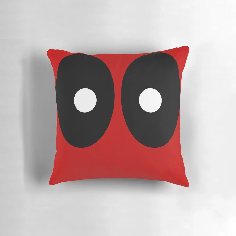 Pillow featuring a modern abstract design with black ellipses and white circles on a red background