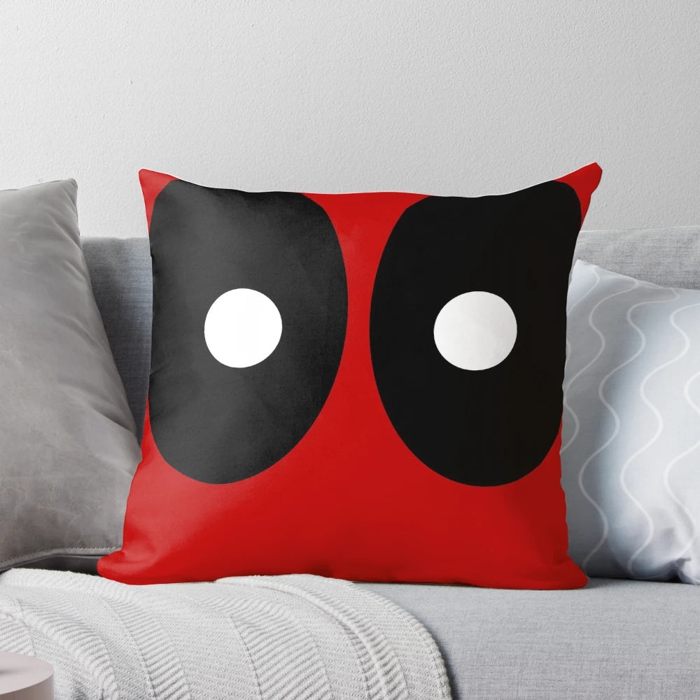 Pillow featuring a modern abstract design with black ellipses and white circles on a red background