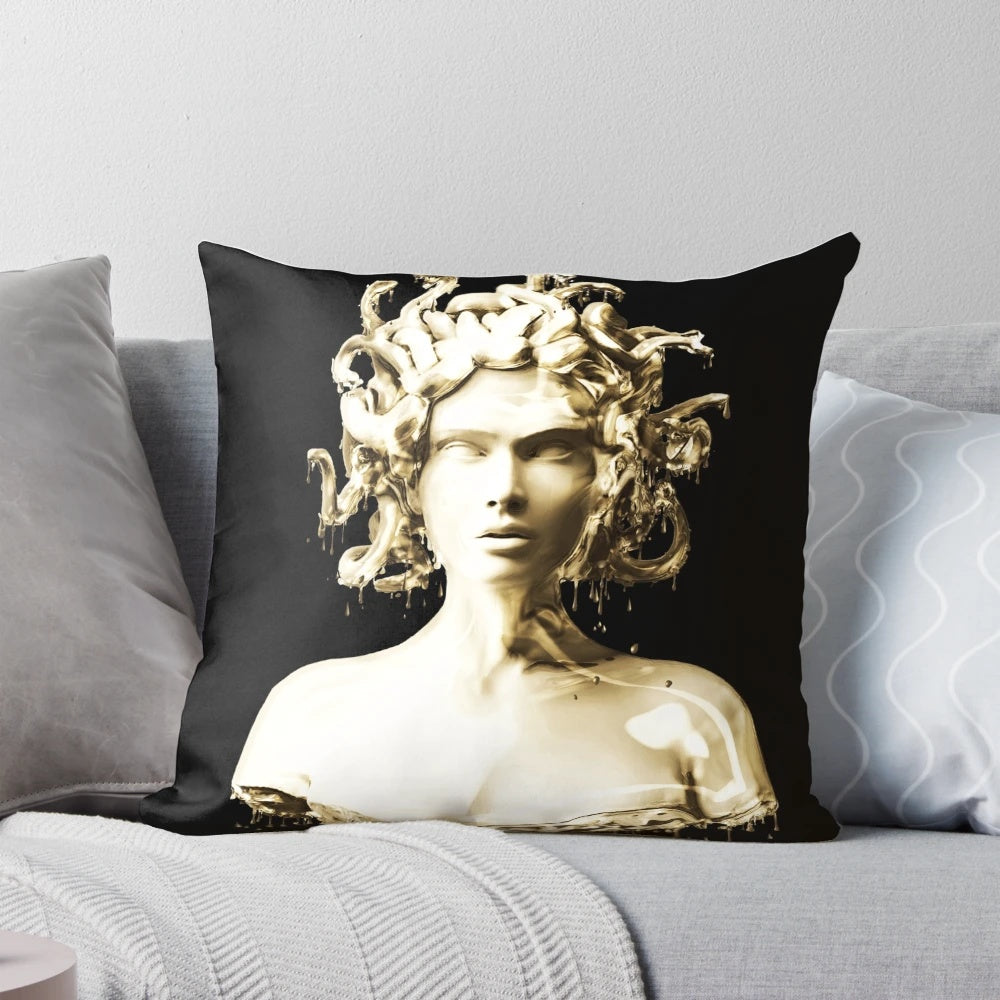 Elegant gold Medusa pillow with a melting, shimmering effect inspired by Greek mythology