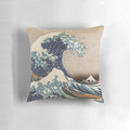 A decorative pillow featuring the iconic "The Great Wave off Kanagawa" artwork by the renowned Japanese artist Hokusai.