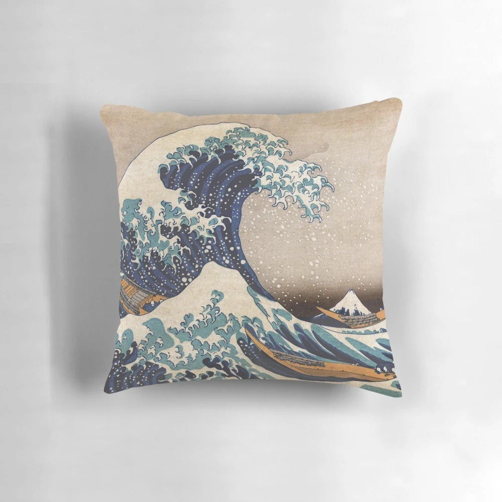 A decorative pillow featuring the iconic "The Great Wave off Kanagawa" artwork by the renowned Japanese artist Hokusai.