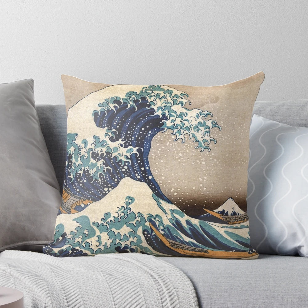 A decorative pillow featuring the iconic "The Great Wave off Kanagawa" artwork by the renowned Japanese artist Hokusai.