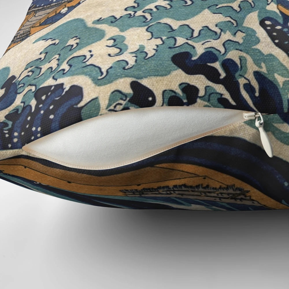 A decorative pillow featuring the iconic "The Great Wave off Kanagawa" artwork by the renowned Japanese artist Hokusai.