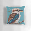 A vibrant and expressive painting of an Australian kookaburra bird on a decorative pillow