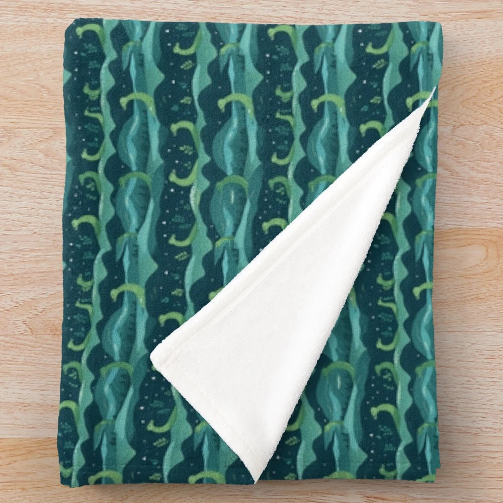Loch Ness plush blanket featuring a vibrant, continuous pattern of the mythical creature