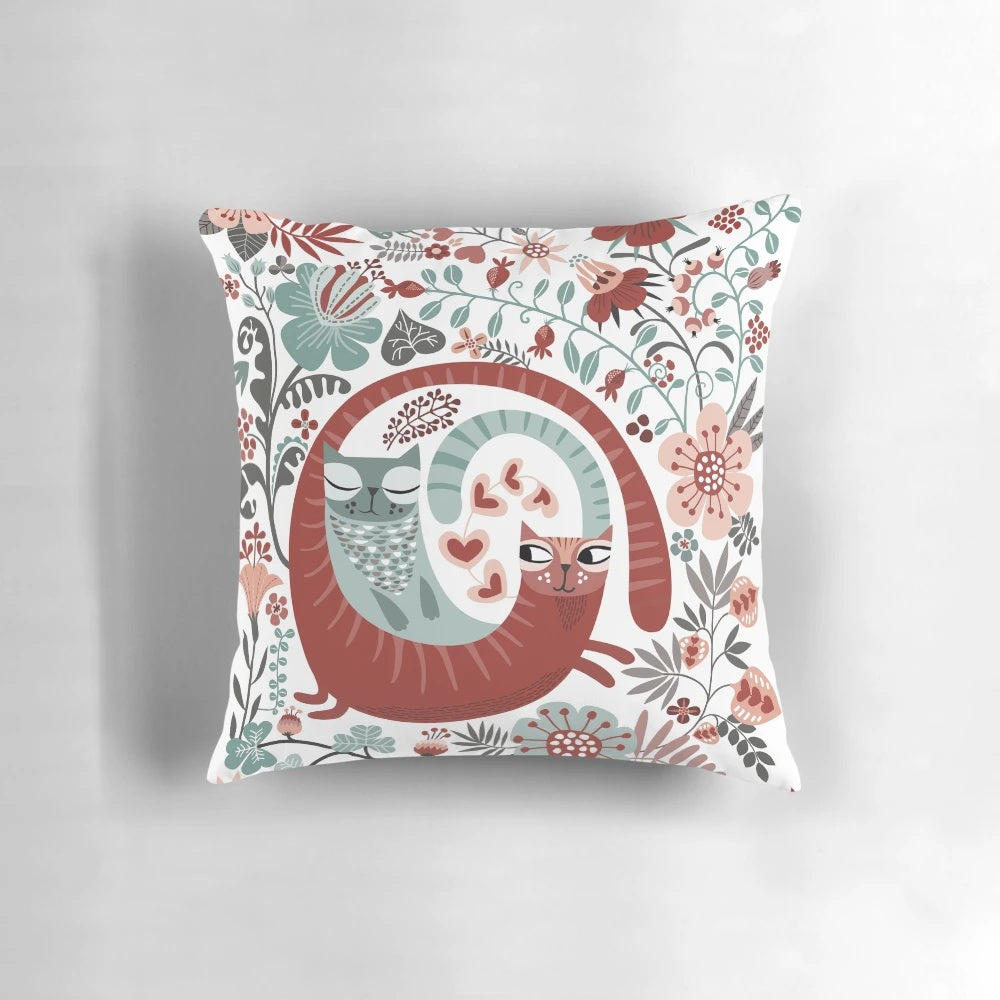 A decorative pillow featuring a retro floral pattern with cats, perfect for cat lovers on Valentine's Day.