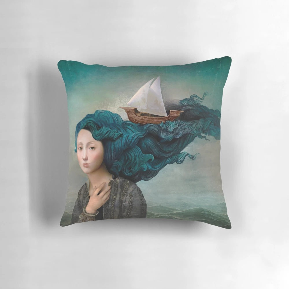 Decorative throw pillow featuring a fantasy image of a woman's hair blending into ocean waves and a ship