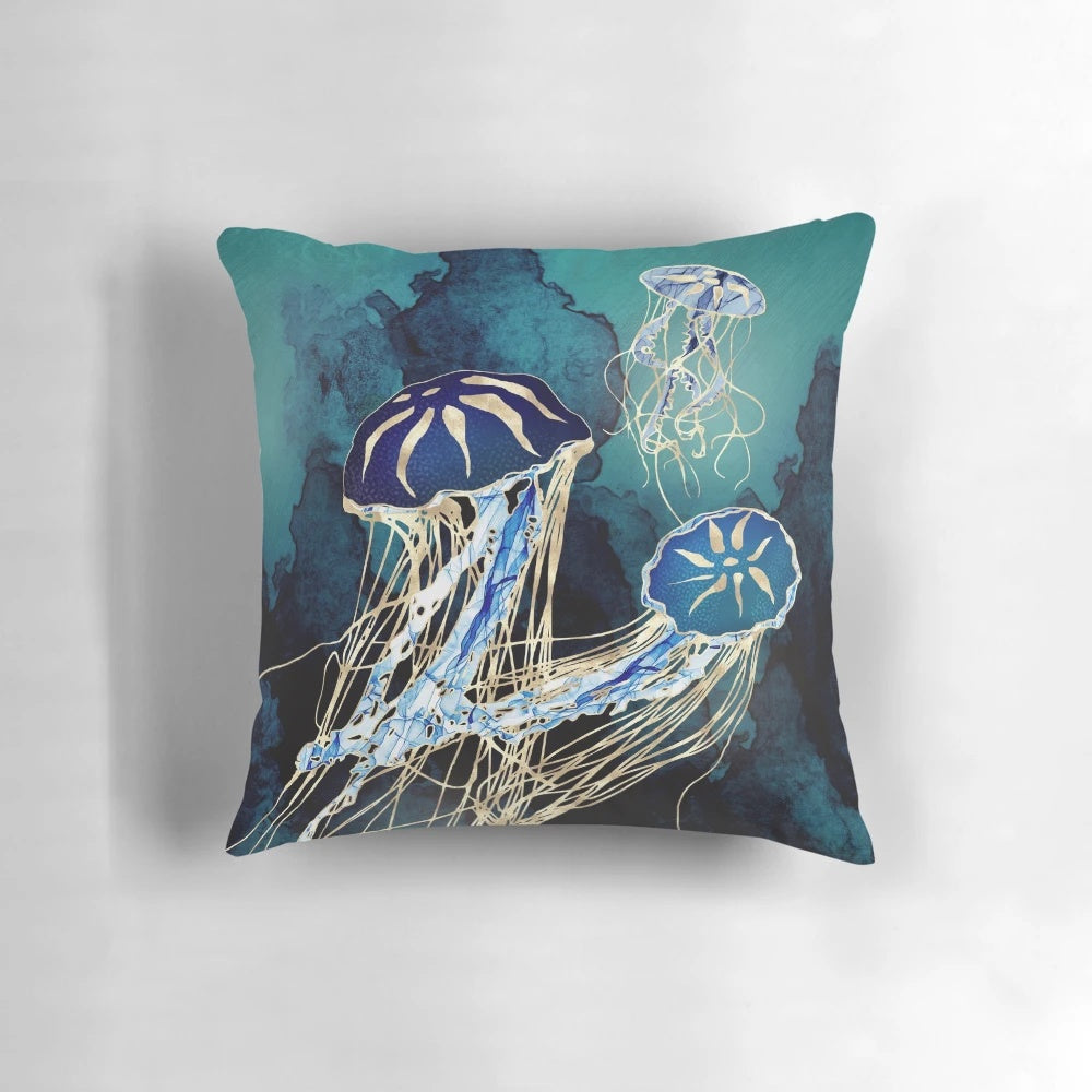 Metallic jellyfish design pillow in hues of blue, indigo, gold, cobalt, and teal