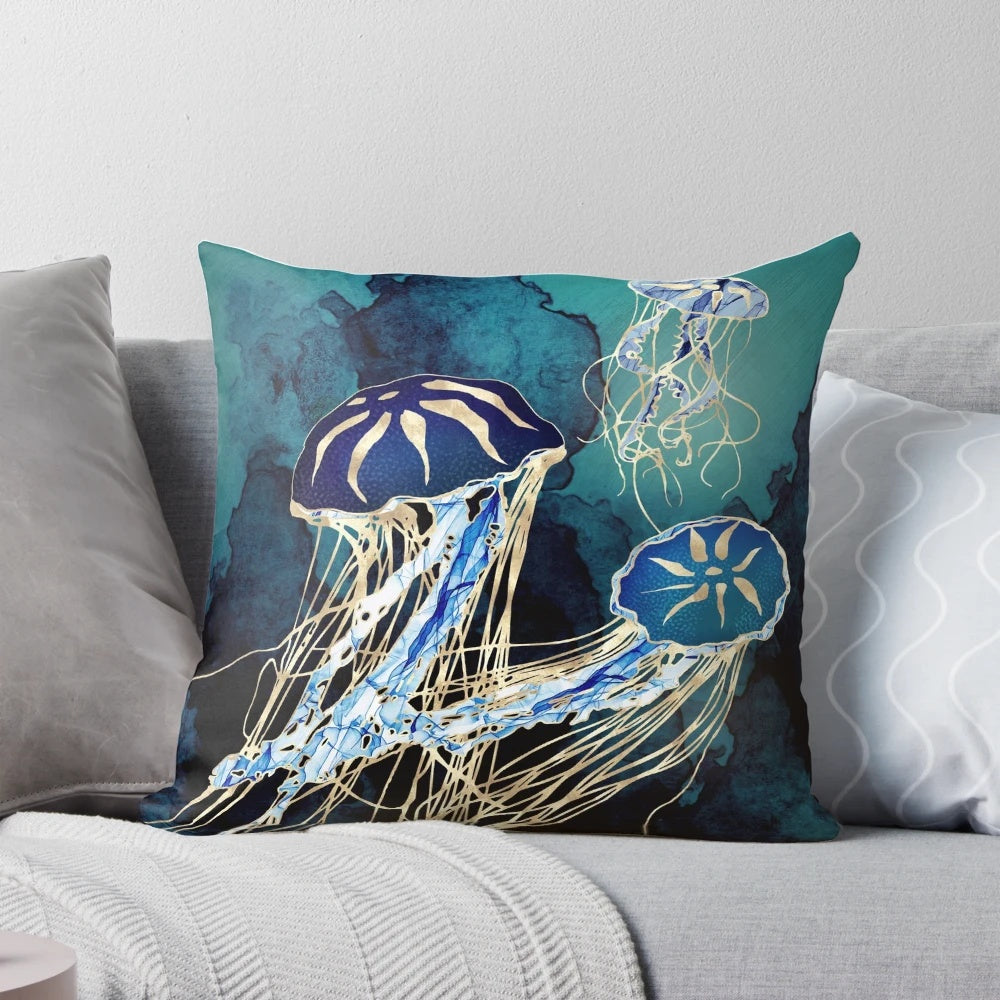 Metallic jellyfish design pillow in hues of blue, indigo, gold, cobalt, and teal