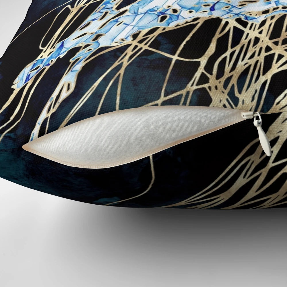 Metallic jellyfish design pillow in hues of blue, indigo, gold, cobalt, and teal