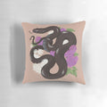A decorative throw pillow featuring a beautiful Mexican black kingsnake coiled among lilac flowers.