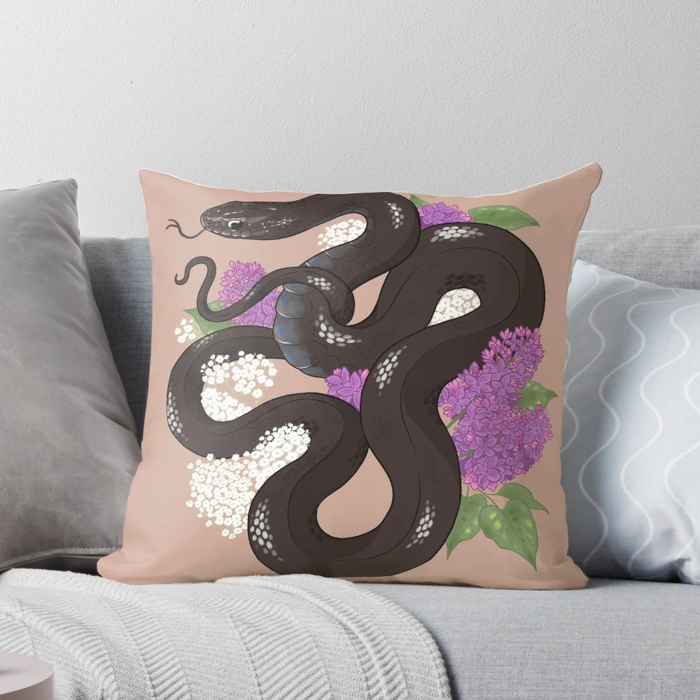 A decorative throw pillow featuring a beautiful Mexican black kingsnake coiled among lilac flowers.