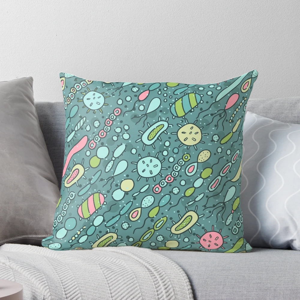 Pillow featuring a vibrant pattern of microbes, bacteria, and viruses for biology enthusiasts.