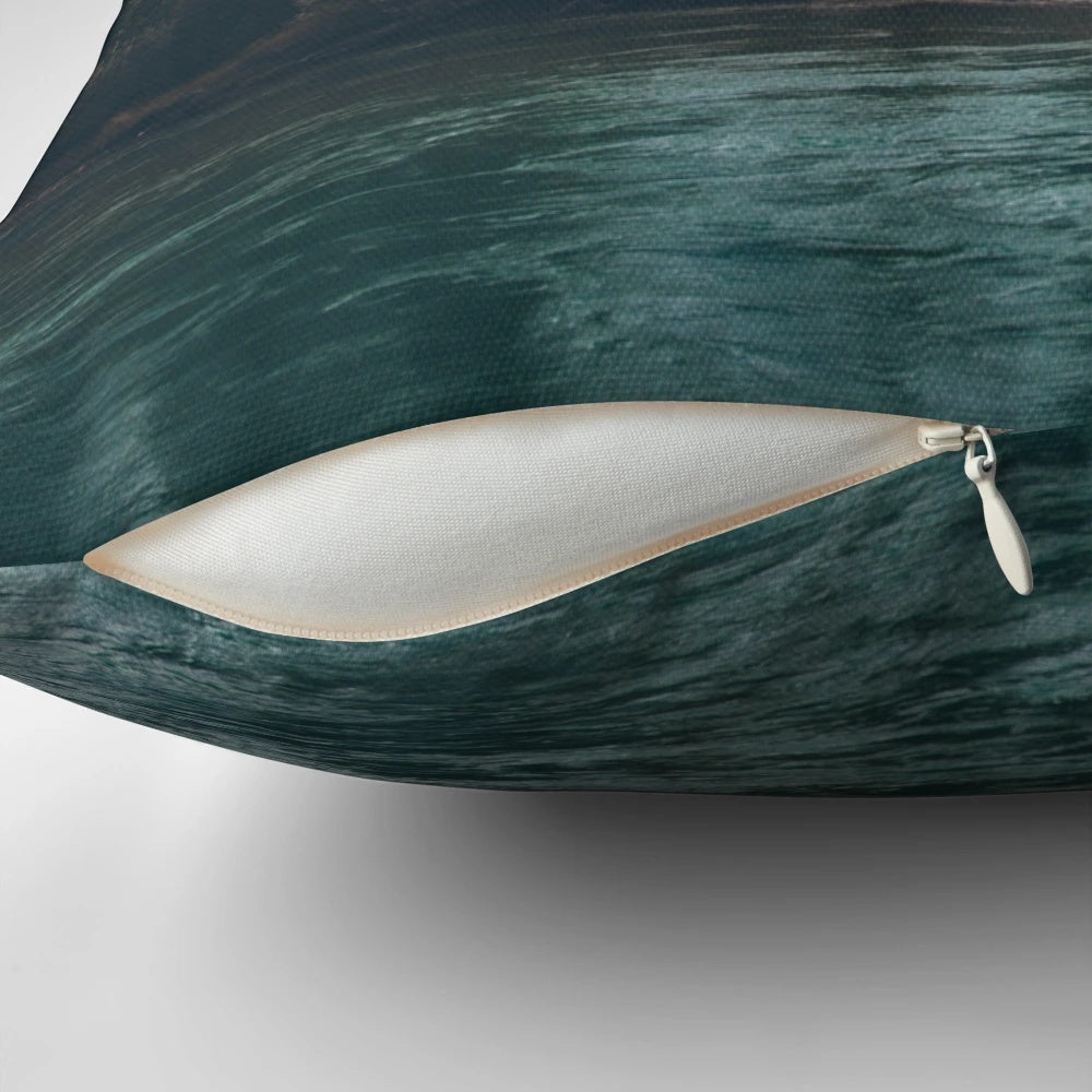 A beautiful pillow featuring a serene mountain river landscape in the Canadian Rockies