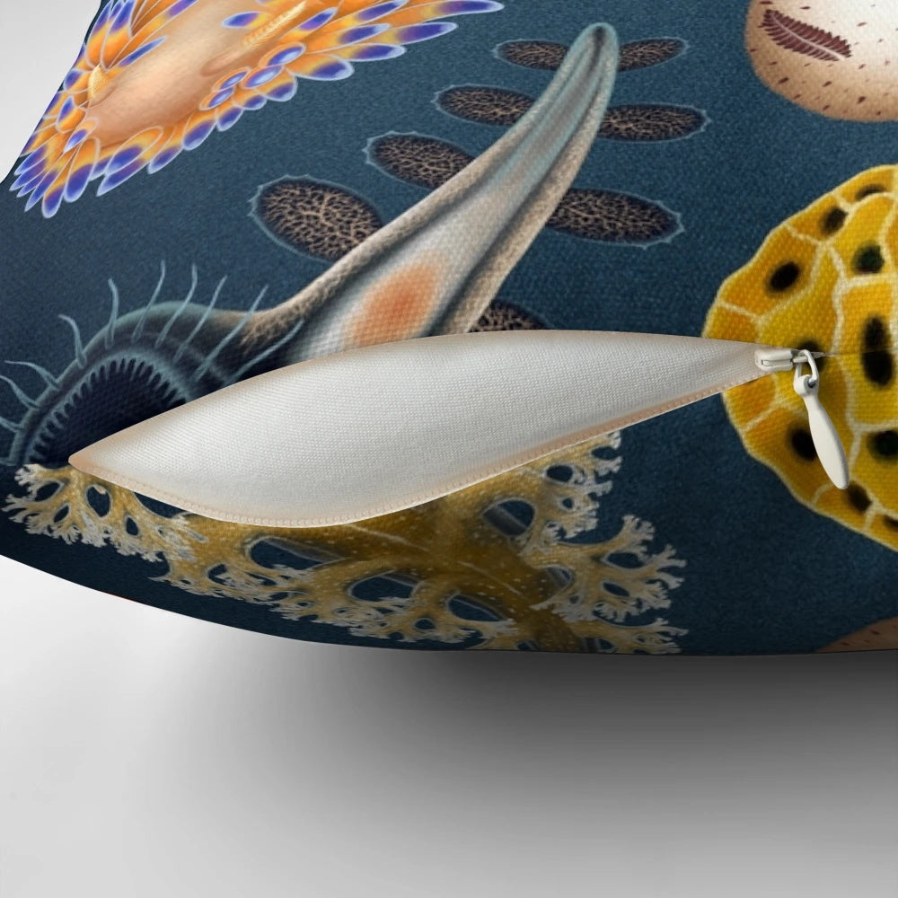 Vibrant nudibranchs (sea slugs) printed on a decorative throw pillow, showcasing the beauty of marine life.