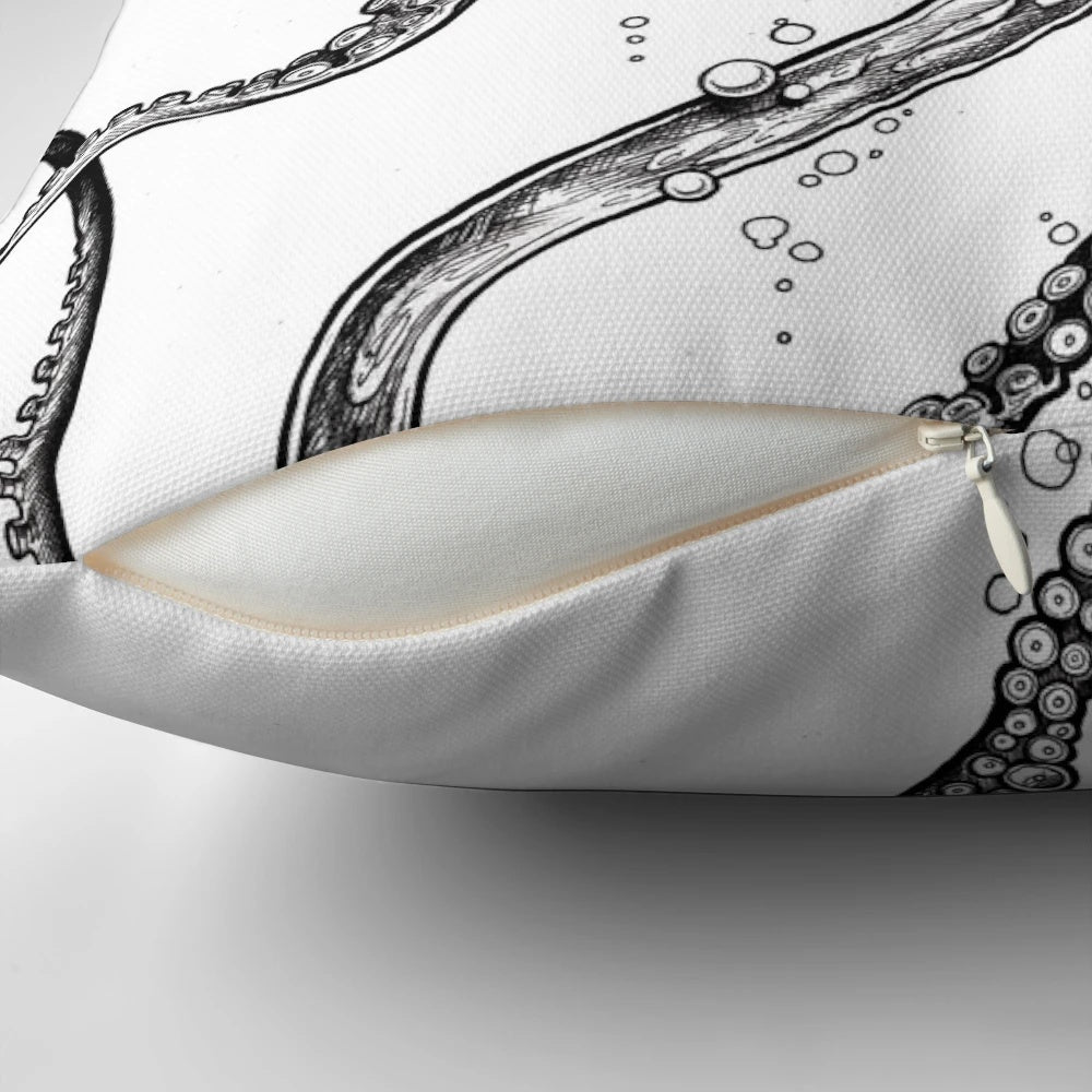 A beautiful black and white octopus pillow, featuring intricate tentacles and a striking design inspired by the ocean.