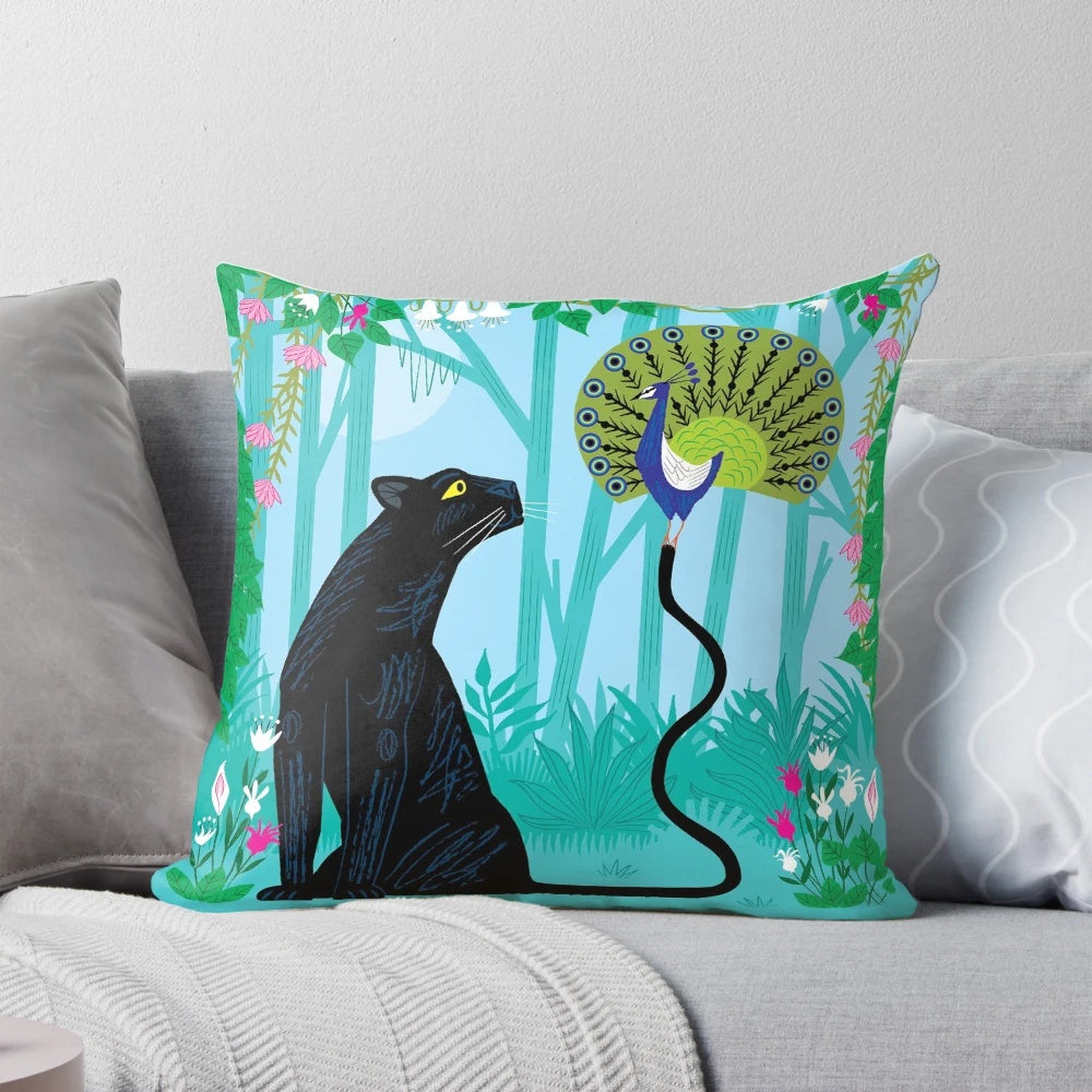 Colorful pillow featuring a peacock and panther in a lush jungle setting