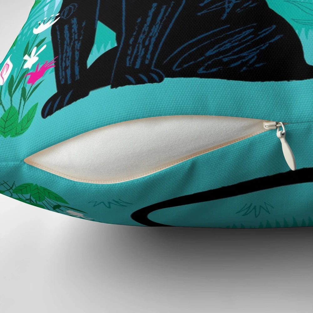 Colorful pillow featuring a peacock and panther in a lush jungle setting