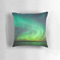 Pillow featuring a stunning image of the vibrant northern lights dancing over a serene Finnish lake