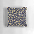 A close-up view of a yellow pistil flower on a dark background, showcasing the Pistil Pillow's captivating design.