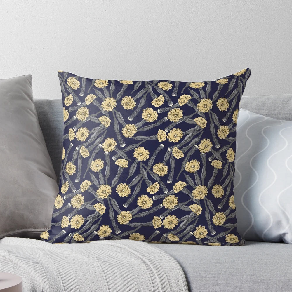 A close-up view of a yellow pistil flower on a dark background, showcasing the Pistil Pillow's captivating design.