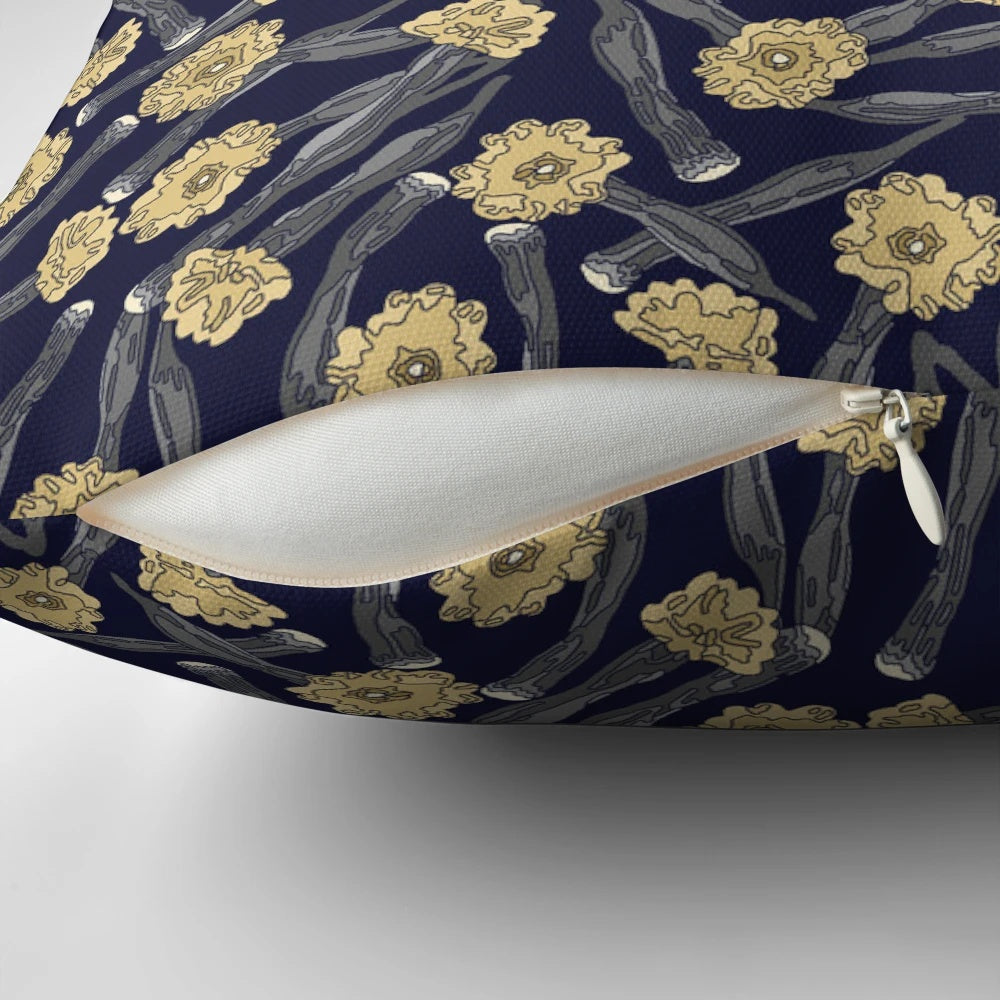 A close-up view of a yellow pistil flower on a dark background, showcasing the Pistil Pillow's captivating design.