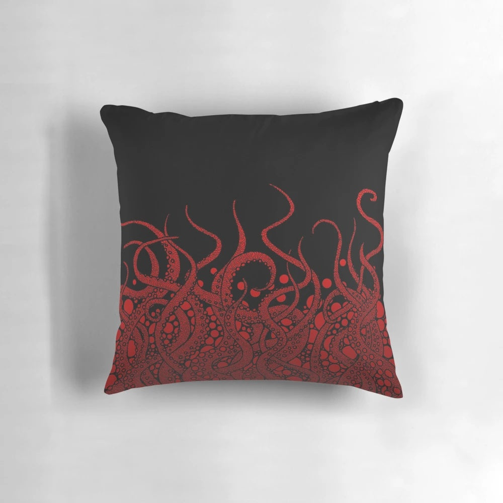 A Pillow featuring a striking red tentacle design against a black background, evoking the mysterious depths of the ocean.