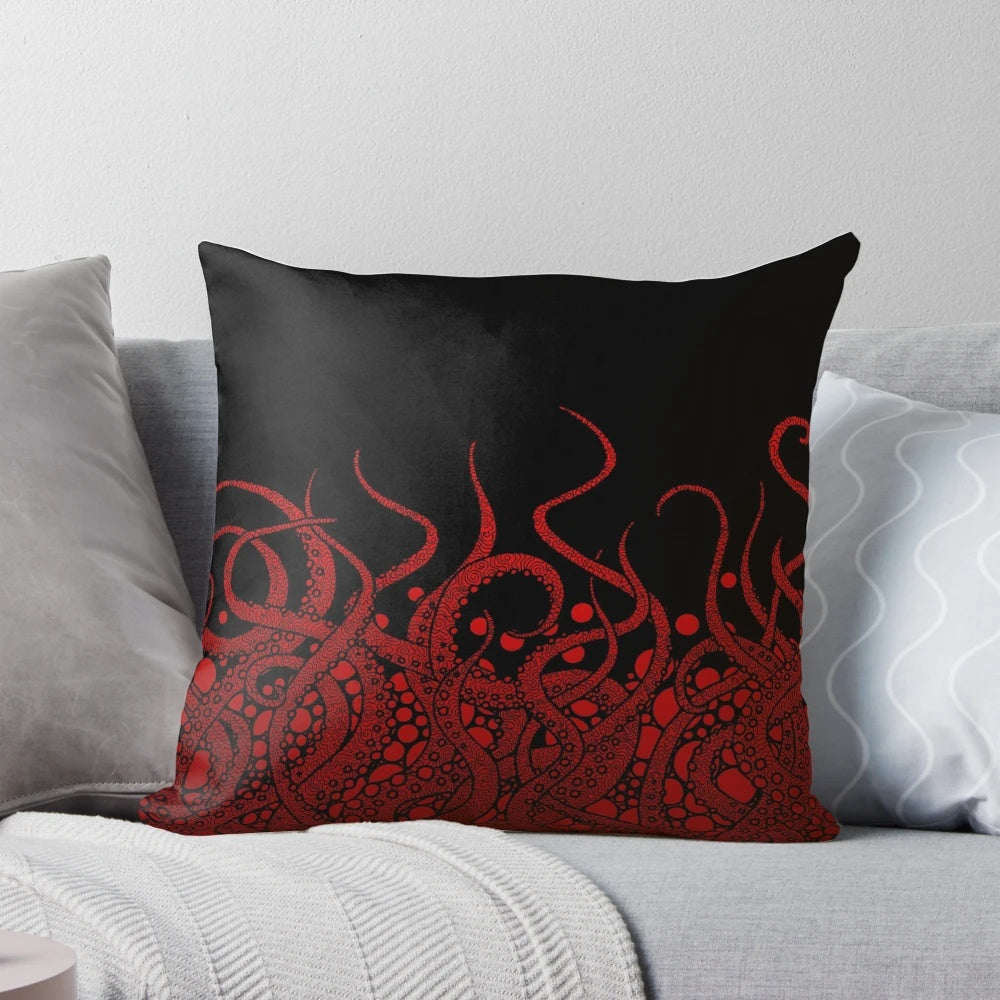A Pillow featuring a striking red tentacle design against a black background, evoking the mysterious depths of the ocean.