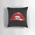 Decorative pillow featuring a vivid graphic of bold, biting lips inspired by the cult classic Rocky Horror Picture Show.