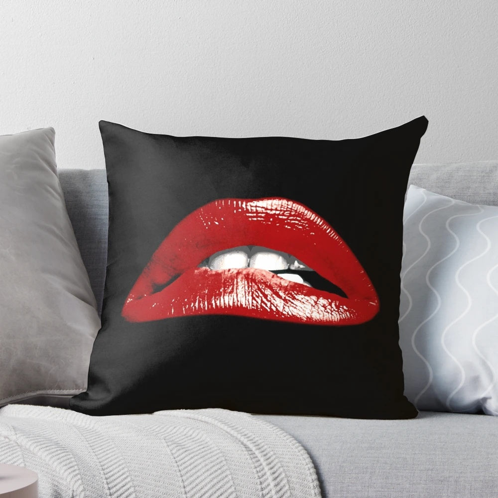 Decorative pillow featuring a vivid graphic of bold, biting lips inspired by the cult classic Rocky Horror Picture Show.