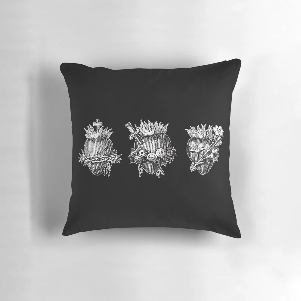 A beautiful decorative pillow featuring the sacred hearts of the Holy Family - Jesus, Mary, and Joseph.