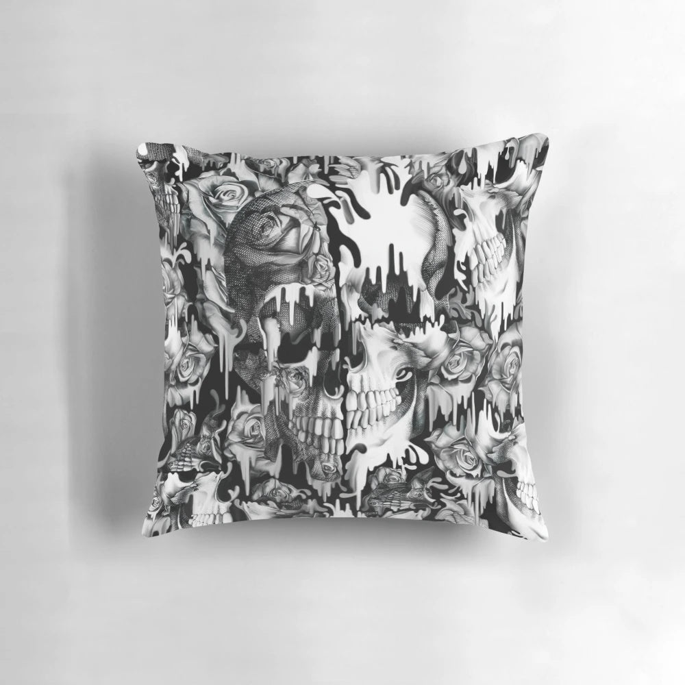 A decorative pillow featuring a striking skull pattern with a splash or dripping effect, perfect for Gothic or rockabilly-inspired home decor.