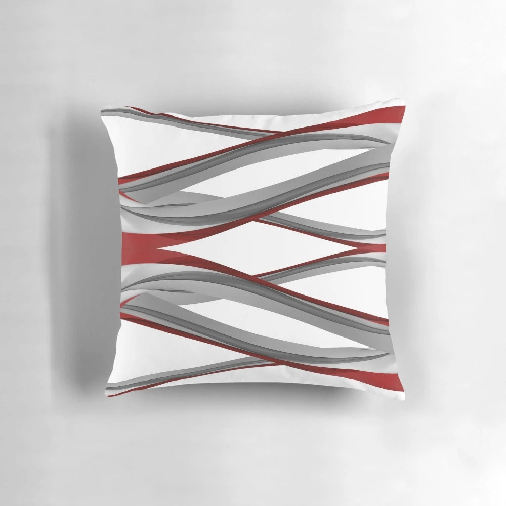 Red and gray spiral design pillow with a modern, abstract art appearance.