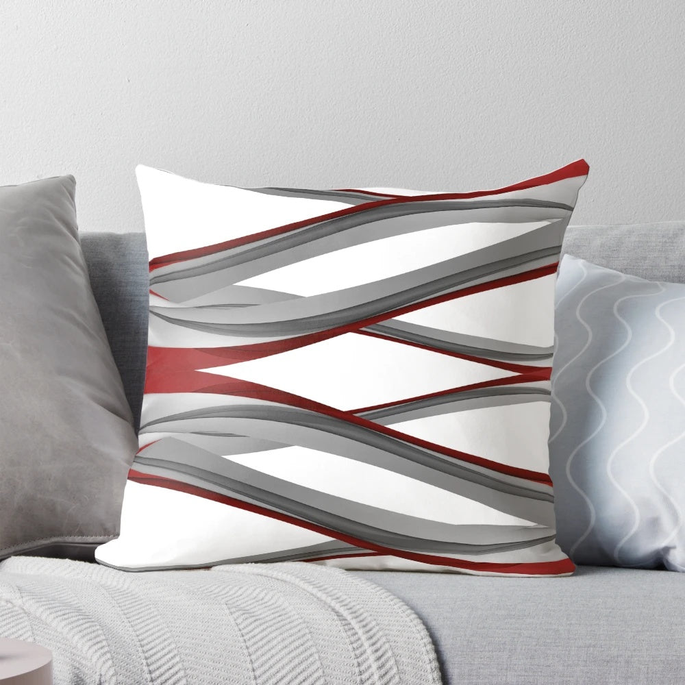 Red and gray spiral design pillow with a modern, abstract art appearance.