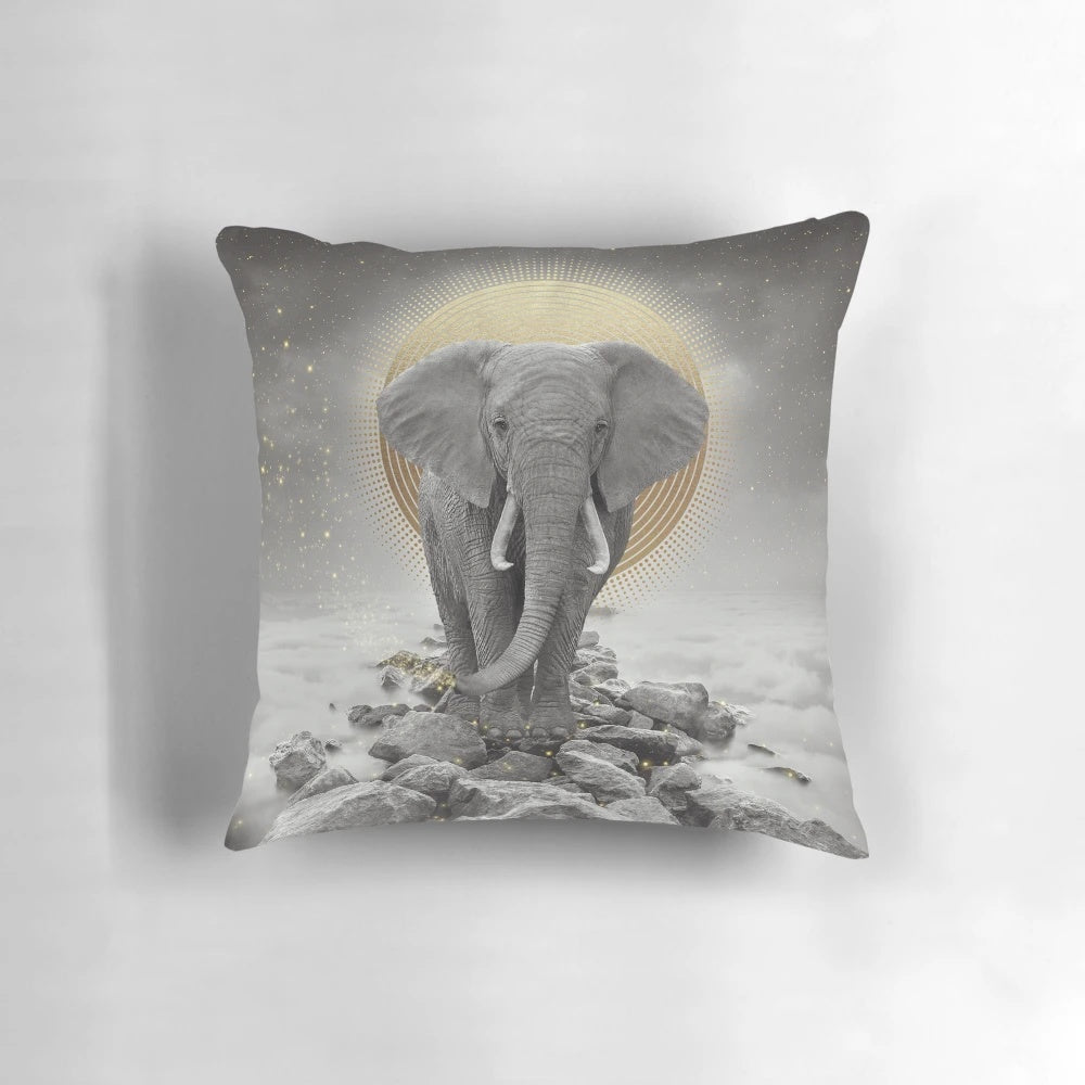 Surreal gray-gold elephant design on a decorative pillow.