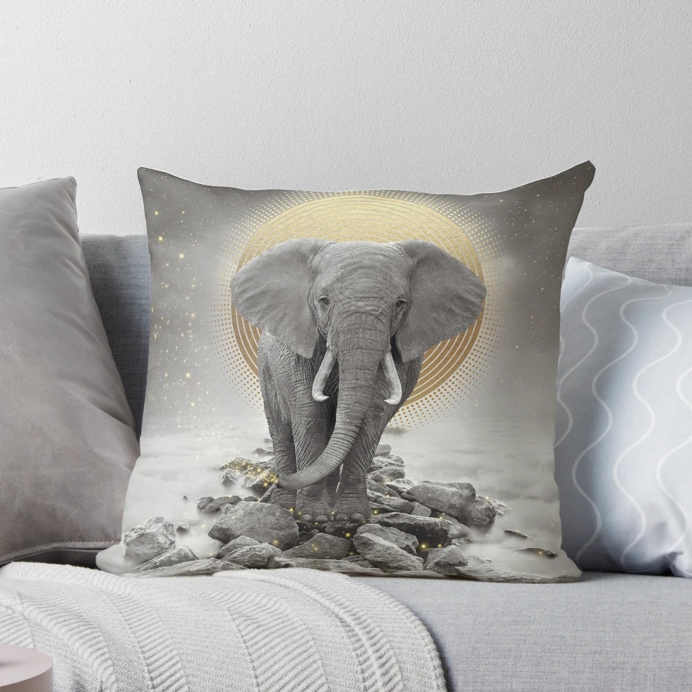Surreal gray-gold elephant design on a decorative pillow.